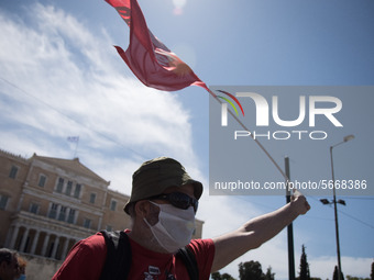 People wearing mask protest on International Worker's Day during the curfew due to Coronavirus (Covid-19) pandemic in Athens, Greece on May...