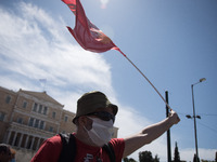 People wearing mask protest on International Worker's Day during the curfew due to Coronavirus (Covid-19) pandemic in Athens, Greece on May...