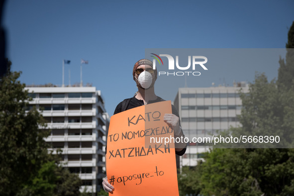 People wearing mask protest on International Worker's Day during the curfew due to Coronavirus (Covid-19) pandemic in Athens, Greece on May...