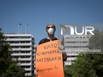 People wearing mask protest on International Worker's Day during the curfew due to Coronavirus (Covid-19) pandemic in Athens, Greece on May...