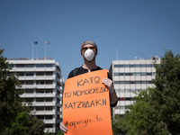 People wearing mask protest on International Worker's Day during the curfew due to Coronavirus (Covid-19) pandemic in Athens, Greece on May...