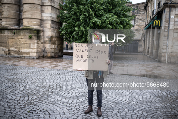 May Day in Bordeaux France, on May 1, 2020, a small group of people demonstrate in the street during the confinement before being checked by...