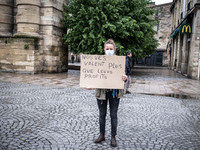 May Day in Bordeaux France, on May 1, 2020, a small group of people demonstrate in the street during the confinement before being checked by...