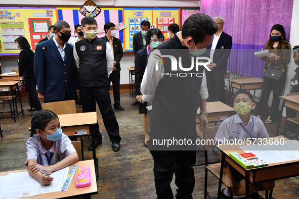 Mr. Kriangyos Sudlabha, Deputy Governor of Bangkok and members of government officer wearing face masks visit a demonstration of learning am...