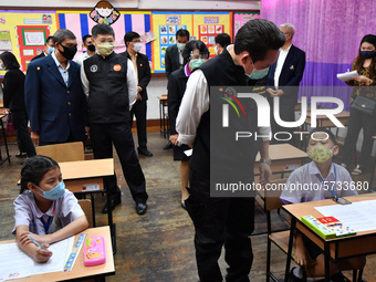 Mr. Kriangyos Sudlabha, Deputy Governor of Bangkok and members of government officer wearing face masks visit a demonstration of learning am...