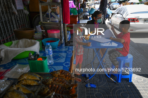 A teacher under the Ministry of Education wearing face shield as a preventive measure in teaches at student home amid the pandemic of the co...