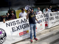 Employees from NISSAN and subcontractors fill a Renault dealership with signs and cut off the access motorway to Barcelona protest in Barcel...