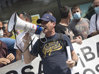 Employees from NISSAN and subcontractors fill a Renault dealership with signs and cut off the access motorway to Barcelona protest in Barcel...