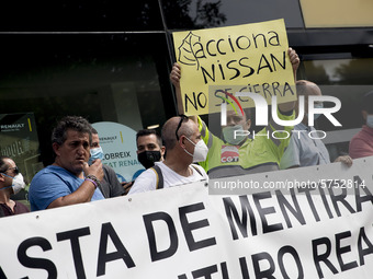 Employees from NISSAN and subcontractors fill a Renault dealership with signs and cut off the access motorway to Barcelona protest in Barcel...