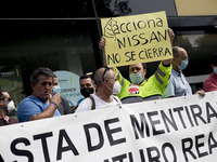 Employees from NISSAN and subcontractors fill a Renault dealership with signs and cut off the access motorway to Barcelona protest in Barcel...