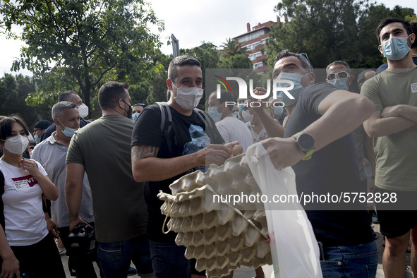 Employees from NISSAN and subcontractors fill a Renault dealership with signs and cut off the access motorway to Barcelona protest in Barcel...