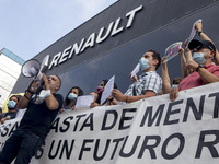 Employees from NISSAN and subcontractors fill a Renault dealership with signs and cut off the access motorway to Barcelona protest in Barcel...