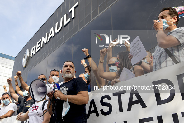 Employees from NISSAN and subcontractors fill a Renault dealership with signs and cut off the access motorway to Barcelona protest in Barcel...