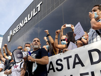 Employees from NISSAN and subcontractors fill a Renault dealership with signs and cut off the access motorway to Barcelona protest in Barcel...