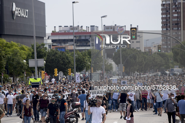 Employees from NISSAN and subcontractors fill a Renault dealership with signs and cut off the access motorway to Barcelona protest in Barcel...