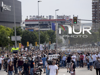 Employees from NISSAN and subcontractors fill a Renault dealership with signs and cut off the access motorway to Barcelona protest in Barcel...