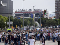 Employees from NISSAN and subcontractors fill a Renault dealership with signs and cut off the access motorway to Barcelona protest in Barcel...