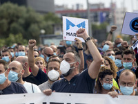 Employees from NISSAN and subcontractors fill a Renault dealership with signs and cut off the access motorway to Barcelona protest in Barcel...