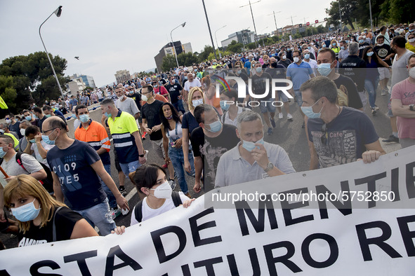 Employees from NISSAN and subcontractors fill a Renault dealership with signs and cut off the access motorway to Barcelona protest in Barcel...