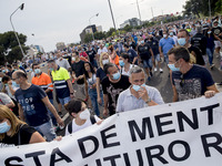 Employees from NISSAN and subcontractors fill a Renault dealership with signs and cut off the access motorway to Barcelona protest in Barcel...