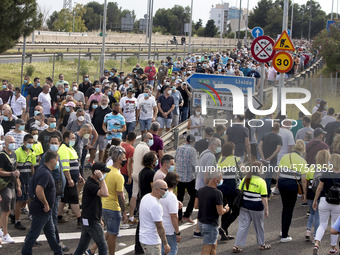 Employees from NISSAN and subcontractors fill a Renault dealership with signs and cut off the access motorway to Barcelona protest in Barcel...