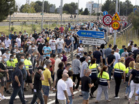 Employees from NISSAN and subcontractors fill a Renault dealership with signs and cut off the access motorway to Barcelona protest in Barcel...