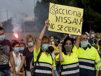 Employees from NISSAN and subcontractors fill a Renault dealership with signs and cut off the access motorway to Barcelona protest in Barcel...