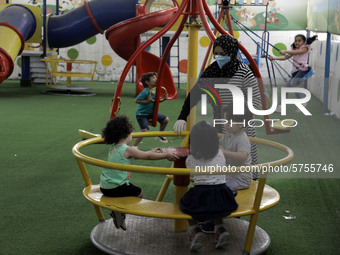 Palestinian children are pictured in a nursery school as it reopens after Palestinians ease the coronavirus disease (COVID-19) restrictions,...