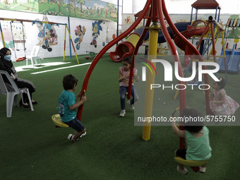 Palestinian children are pictured in a nursery school as it reopens after Palestinians ease the coronavirus disease (COVID-19) restrictions,...