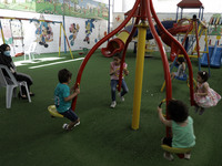 Palestinian children are pictured in a nursery school as it reopens after Palestinians ease the coronavirus disease (COVID-19) restrictions,...