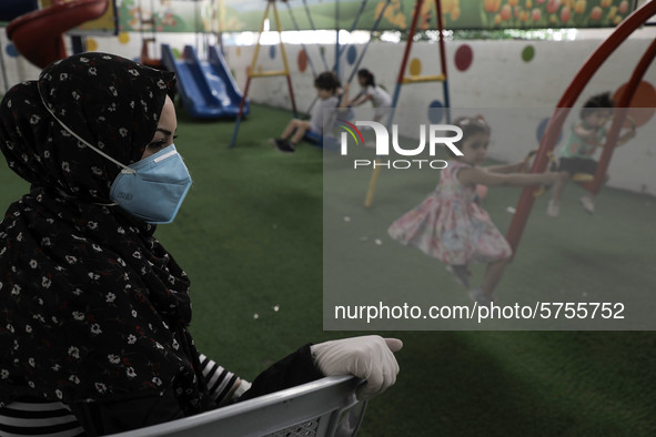 Palestinian children are pictured in a nursery school as it reopens after Palestinians ease the coronavirus disease (COVID-19) restrictions,...