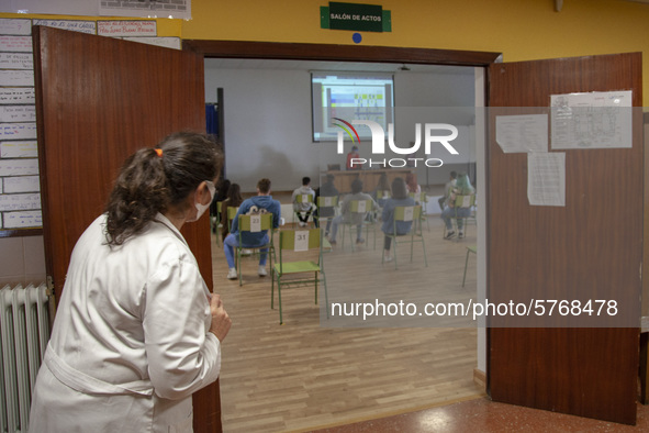 A teacher counts the students who attend the first voluntary review class for the university entrance exam, the EBAU in Norena, Spain, on Ju...