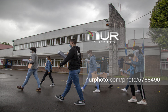 Several students leave the educational center with the documentation to sit for the university entrance exam, EBAU in Norena, Spain, on June...