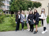 A group of young adults pose to be photographed before taking final graduation exam, called maturity exams in the First General Education Hi...