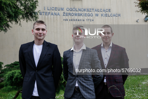 A group of young adults pose to be photographed before taking final graduation exams, called maturity exams in the First General Education H...