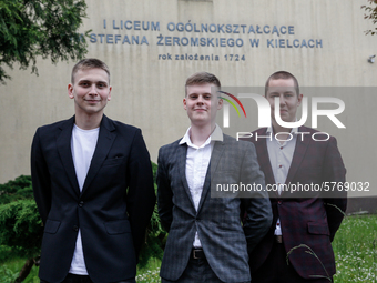 A group of young adults pose to be photographed before taking final graduation exams, called maturity exams in the First General Education H...