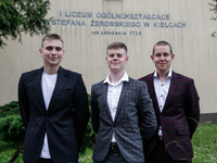 A group of young adults pose to be photographed before taking final graduation exams, called maturity exams in the First General Education H...