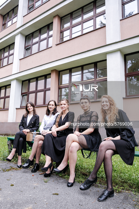 A group of young adults pose to be photographed before taking final graduation exams, called maturity exams in the First General Education H...