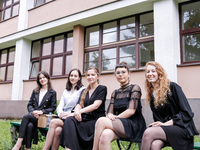 A group of young adults pose to be photographed before taking final graduation exams, called maturity exams in the First General Education H...