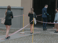 Students of the 12th high school are waiting for entry for the matura exam during pandemic on June 9, 2020 in Wroclaw, Poland. (