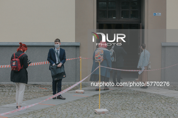 Students of the 12th high school are waiting for entry for the matura exam during pandemic on June 9, 2020 in Wroclaw, Poland. 