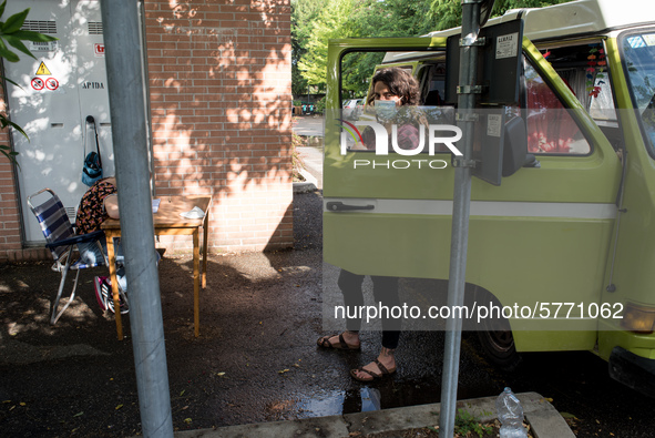 Giulia Zaffagnini, middle school teacher, and one of her pupils during a lesson in a van under the student's house while the schools are clo...