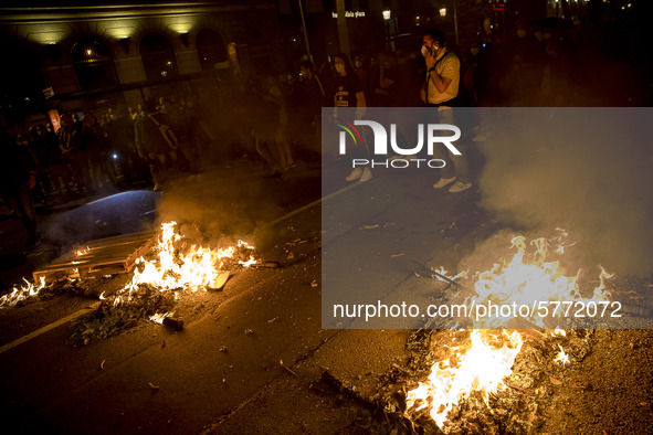 Nissan employees burn mock coffins while holding a banner reading ''Stop lies, we demand a real future'' during a protest against the closur...