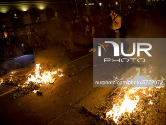 Nissan employees burn mock coffins while holding a banner reading ''Stop lies, we demand a real future'' during a protest against the closur...