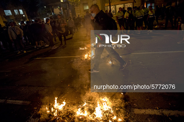 Nissan employees burn mock coffins while holding a banner reading ''Stop lies, we demand a real future'' during a protest against the closur...