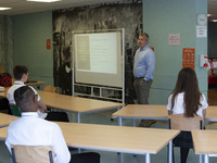   Year 10 pupils watch on as the head teacher gives a presentation. Ortu Gable Hall School in Corringham, Essex return after a long break du...