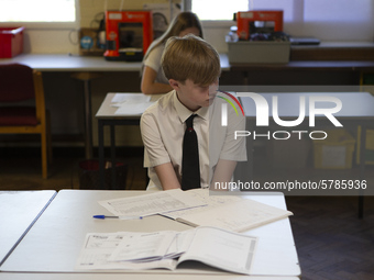   A year 10 pupil with work in front of him. Ortu Gable Hall School in Corringham, Essex return after a long break due to the COVID-19 pande...