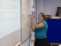  A teacher at the front of a class of Year 10 pupils. Ortu Gable Hall School in Corringham, Essex return after a long break due to the COVID...