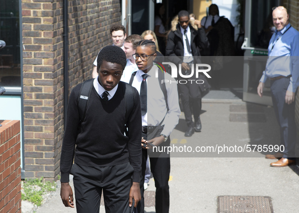   Year 10 pupils walking a long the path to get into the canteen for their break. Ortu Gable Hall School in Corringham, Essex return after a...