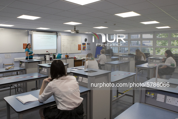  A view of a teacher teaching a class of Year 10 pupils. Ortu Gable Hall School in Corringham, Essex return after a long break due to the CO...